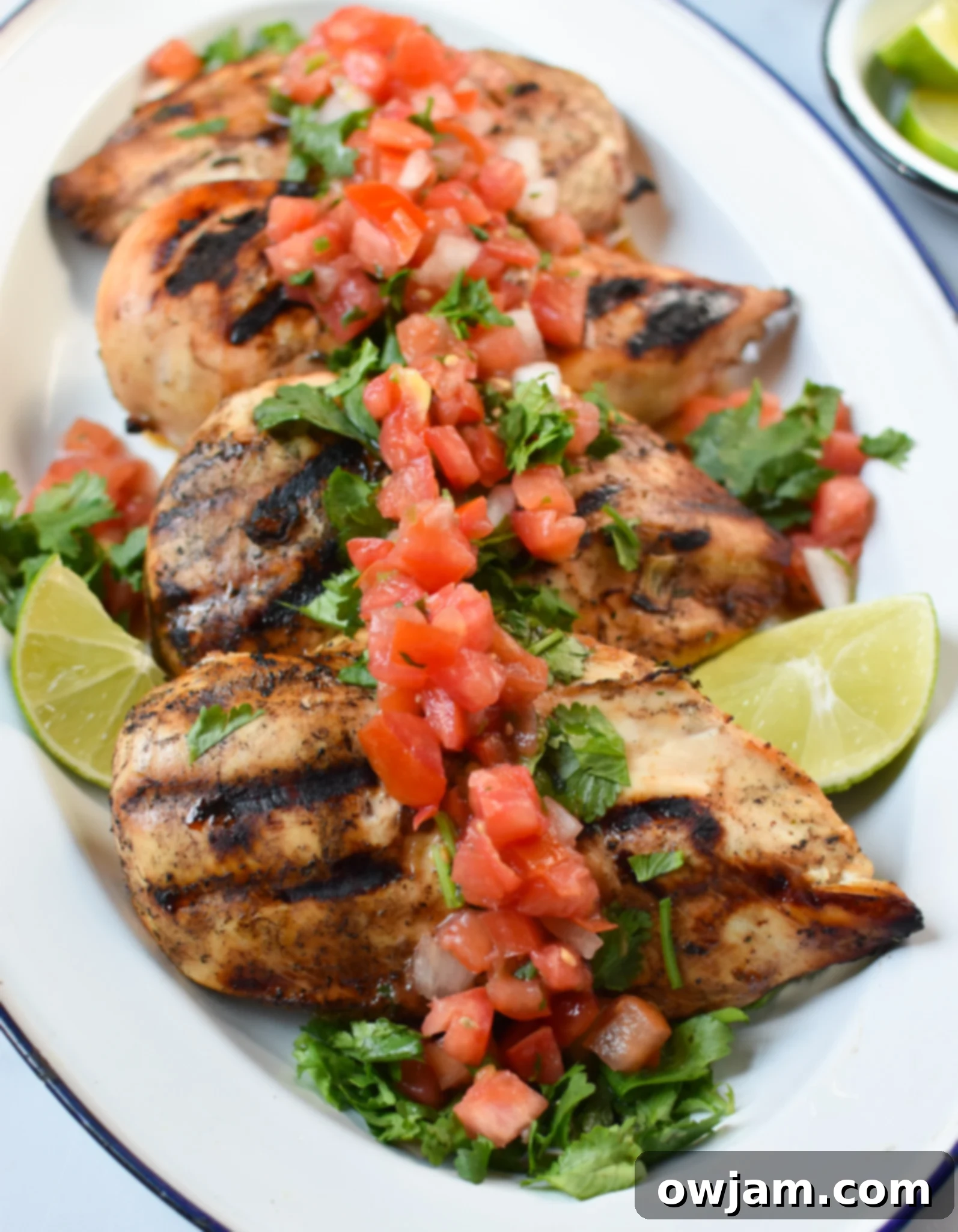 Margarita Marinated Grilled Chicken 4 Cooked Margarita Grilled Chicken arranged neatly on a platter, ready to be served, showcasing its golden-brown char.