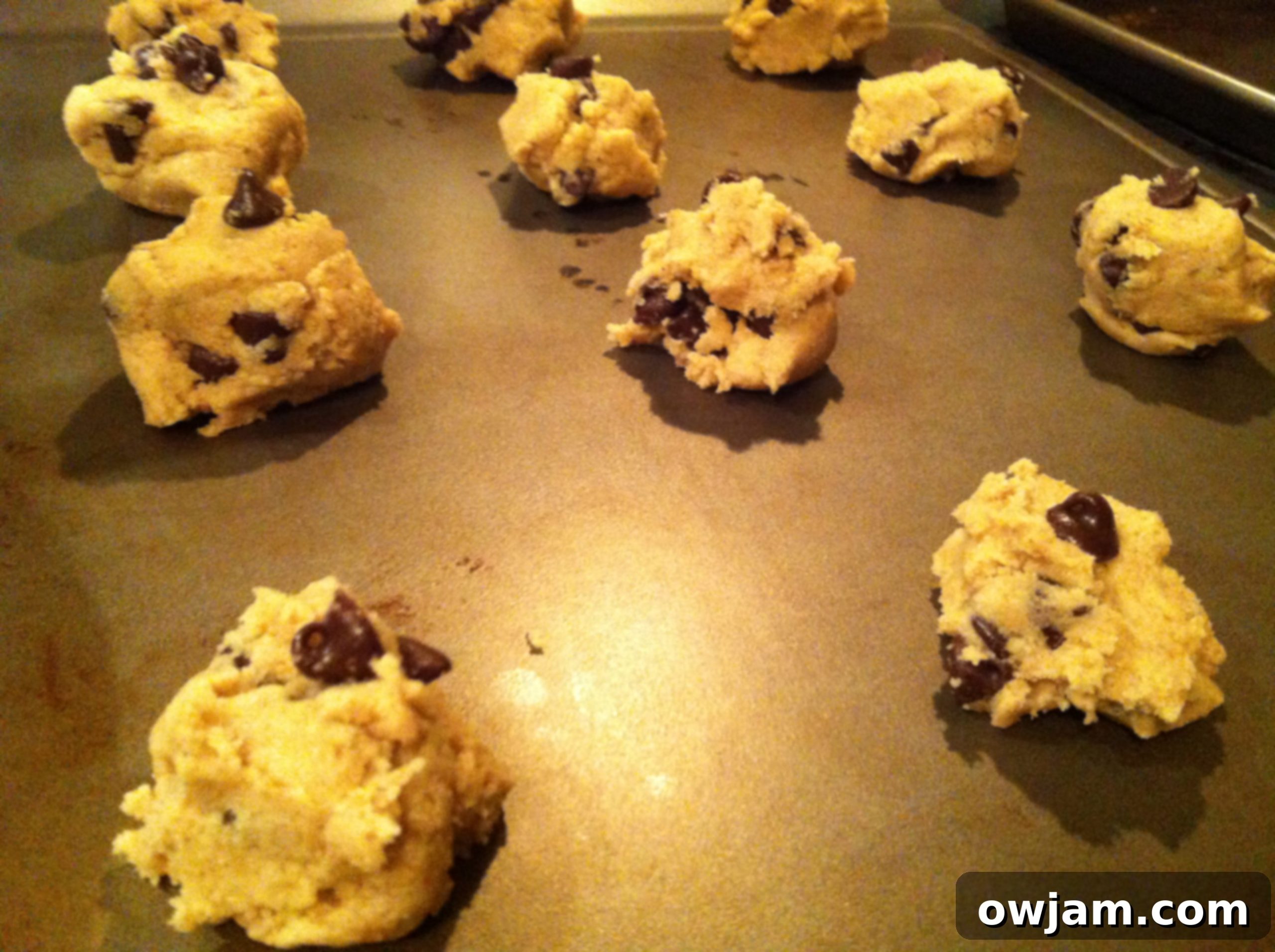 Cookie dough scoops ready for baking, promising delicious Double Chip Chocolate Chunk Cookies
