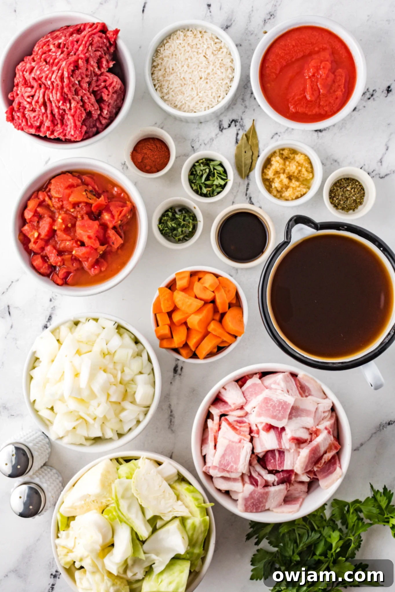 Deconstructed Cabbage Roll Soup 3 Individual ingredients laid out for Cabbage Roll Soup, including ground beef, cabbage, tomatoes, and spices.
