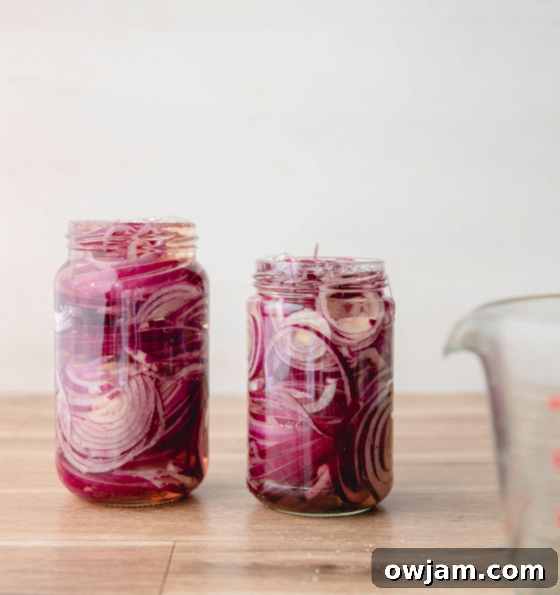 Quick Pickled Red Onions in two mason jars.