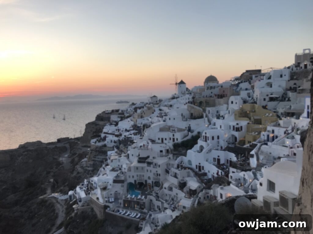 Vibrant Mediterranean Quinoa Salad 4 The picturesque island of Santorini, Greece, at sunset, with traditional white buildings and blue domes overlooking the caldera and the Aegean Sea.