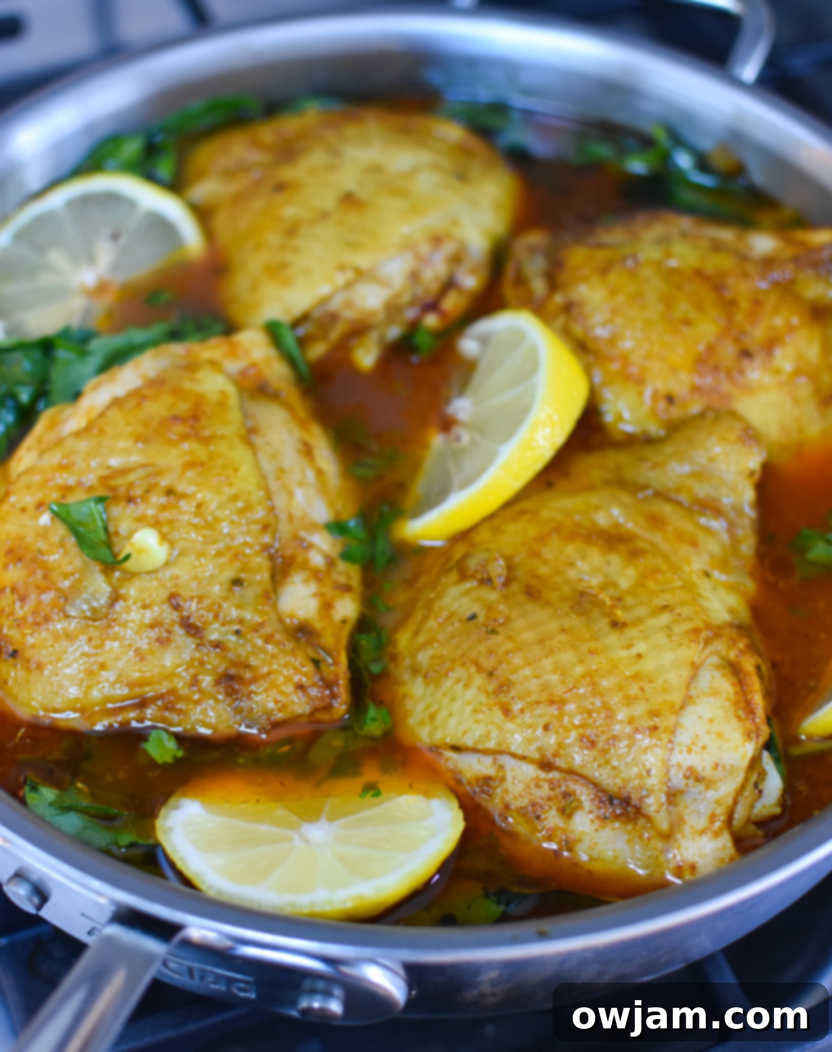 One Pot Mediterranean Chicken and Rice assembling in a pot before baking.
