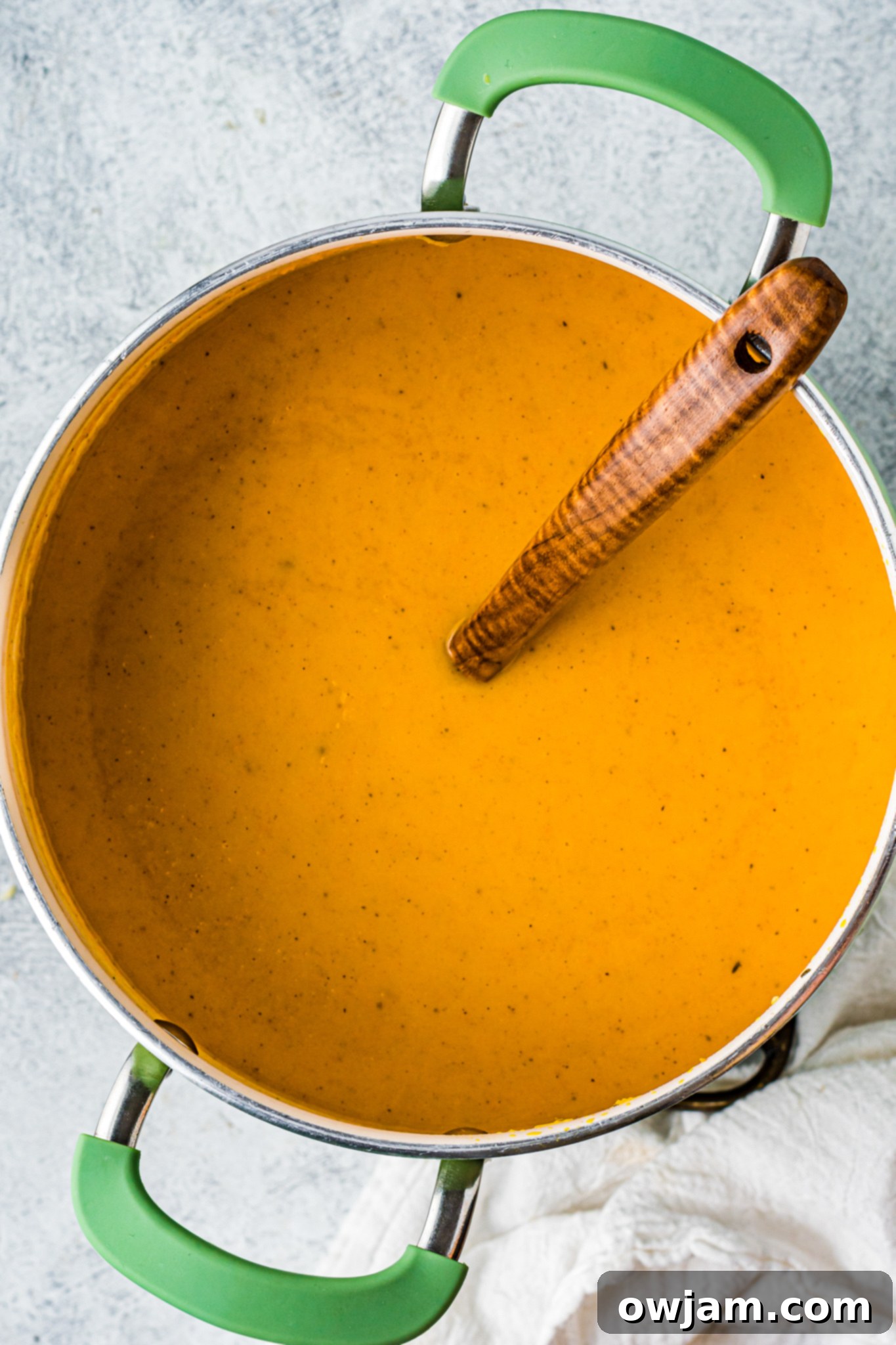 Golden Butternut Sweet Potato Comfort 9 Pureed Butternut Squash and Sweet Potato Soup in a pot.