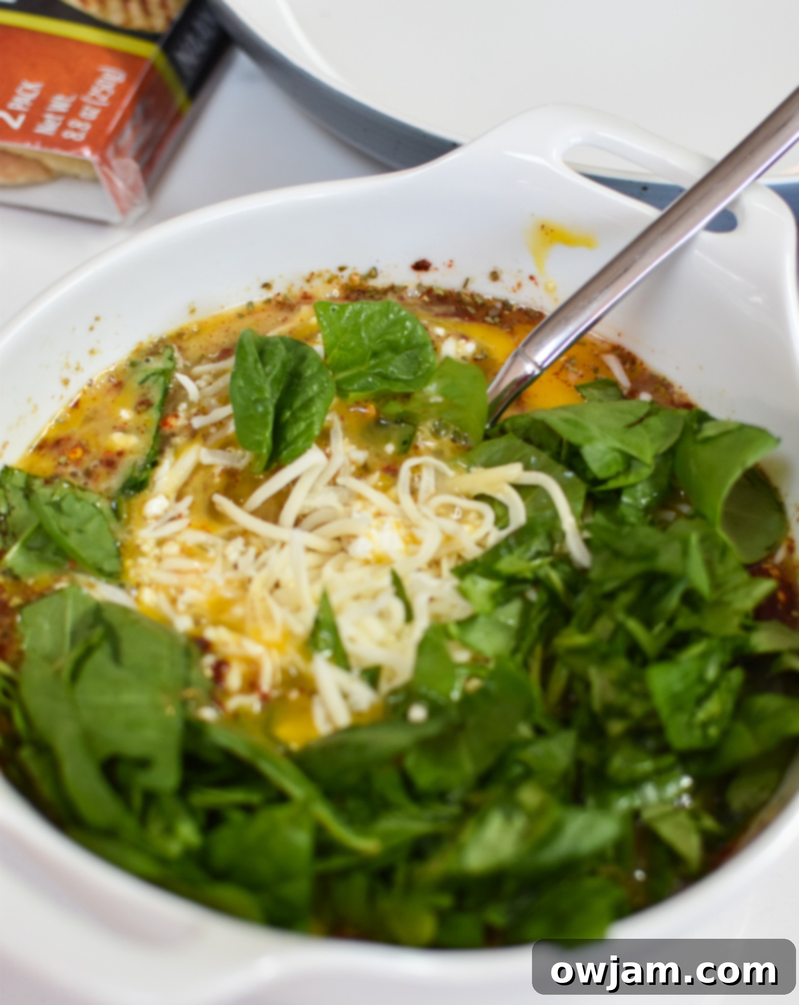 Crispy Mediterranean Feta Parcels 5 Mediterranean Quiche Wontons filling ingredients in a bowl.