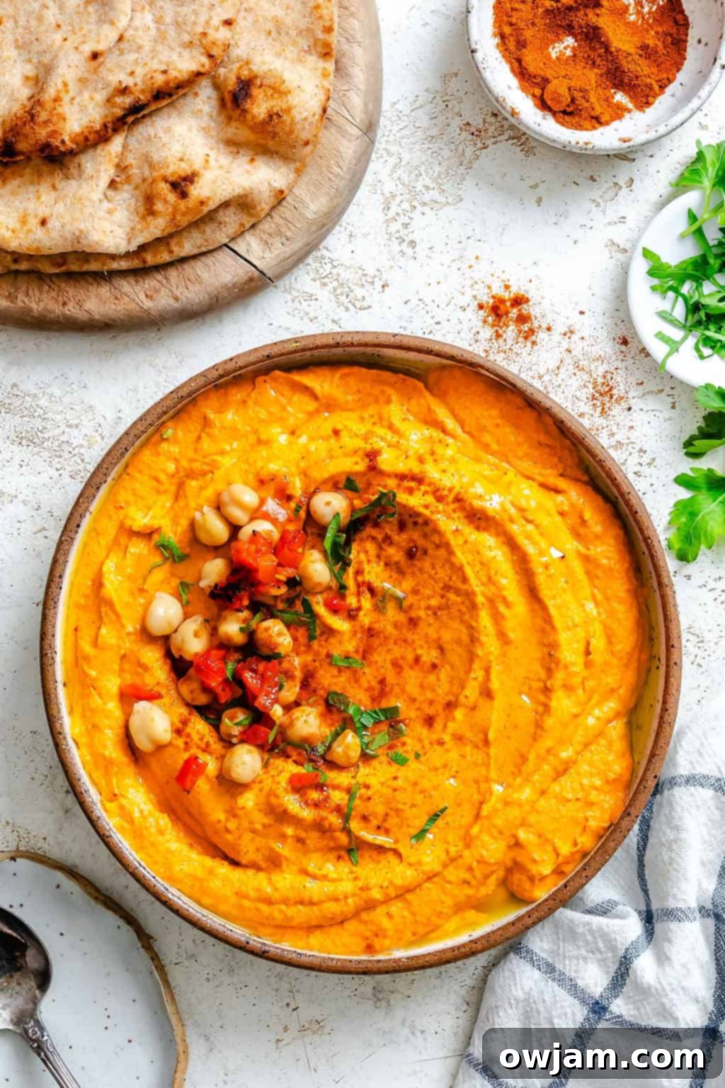 Smoky Red Pepper Hummus 7 Roasted Red Pepper Hummus in a bowl with chickpeas