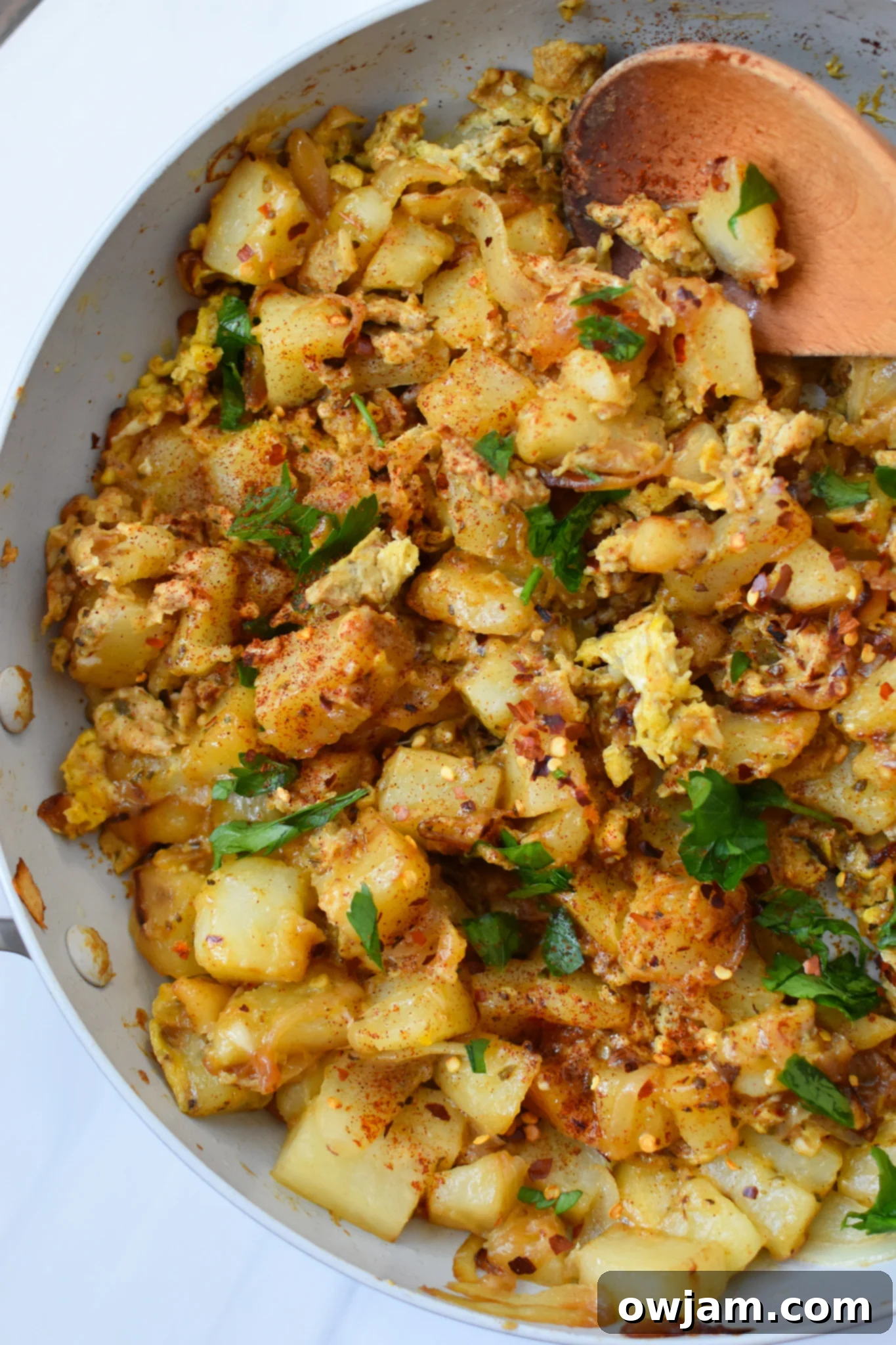 Savory Lebanese Potato and Egg Dish 11 Lebanese Potato and Egg Recipe, garnished with green onions and parsley, ready to eat.