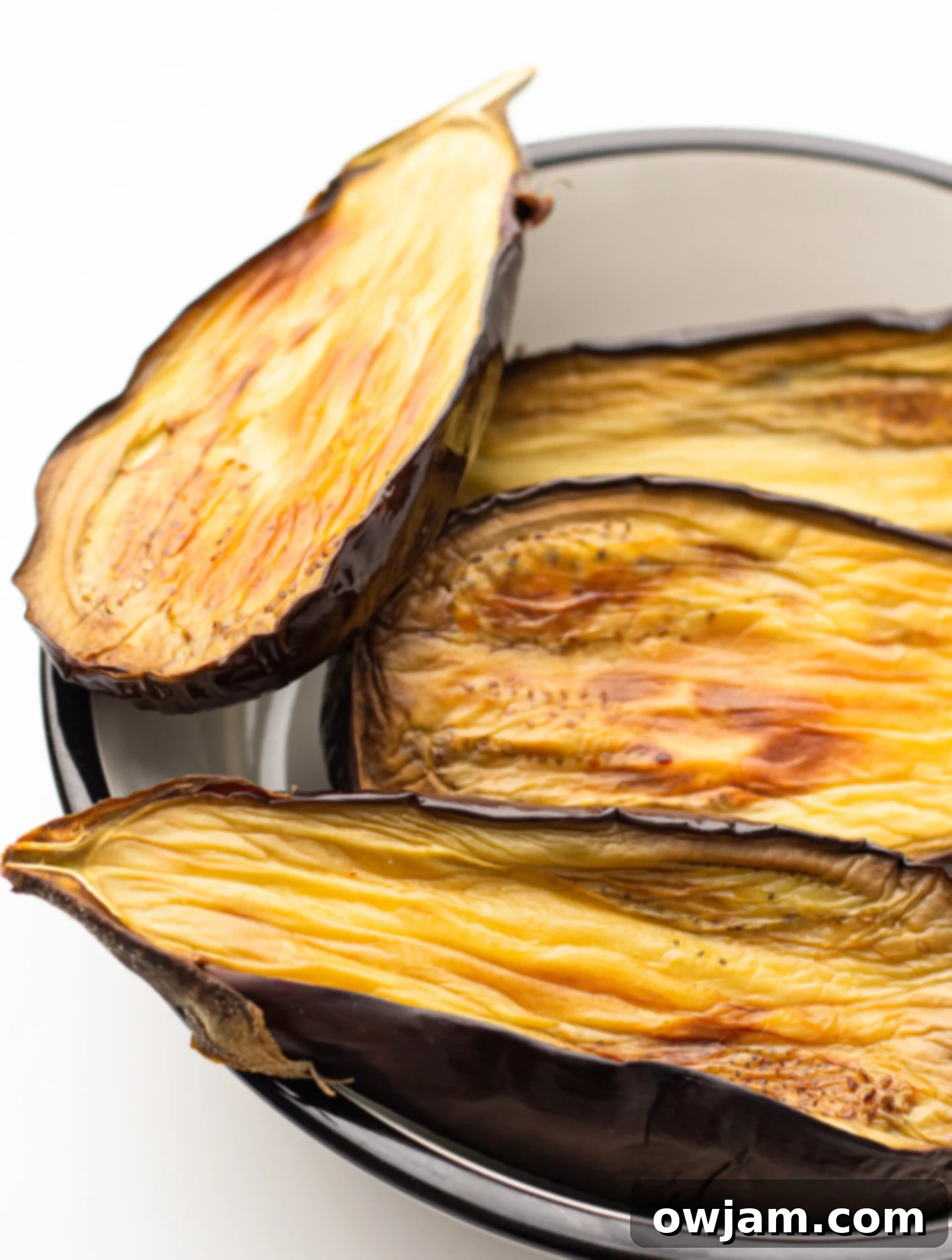 Air Fryer Eggplant in the air fryer cooking. 