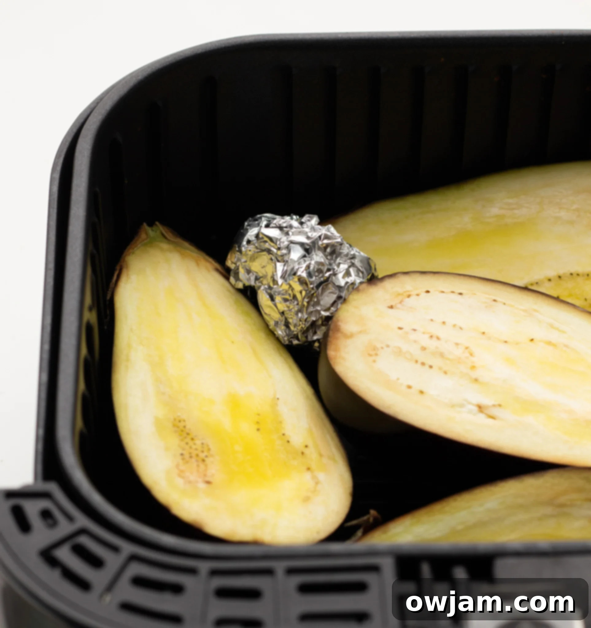 Air Fryer Eggplant with garlic in air fryer.