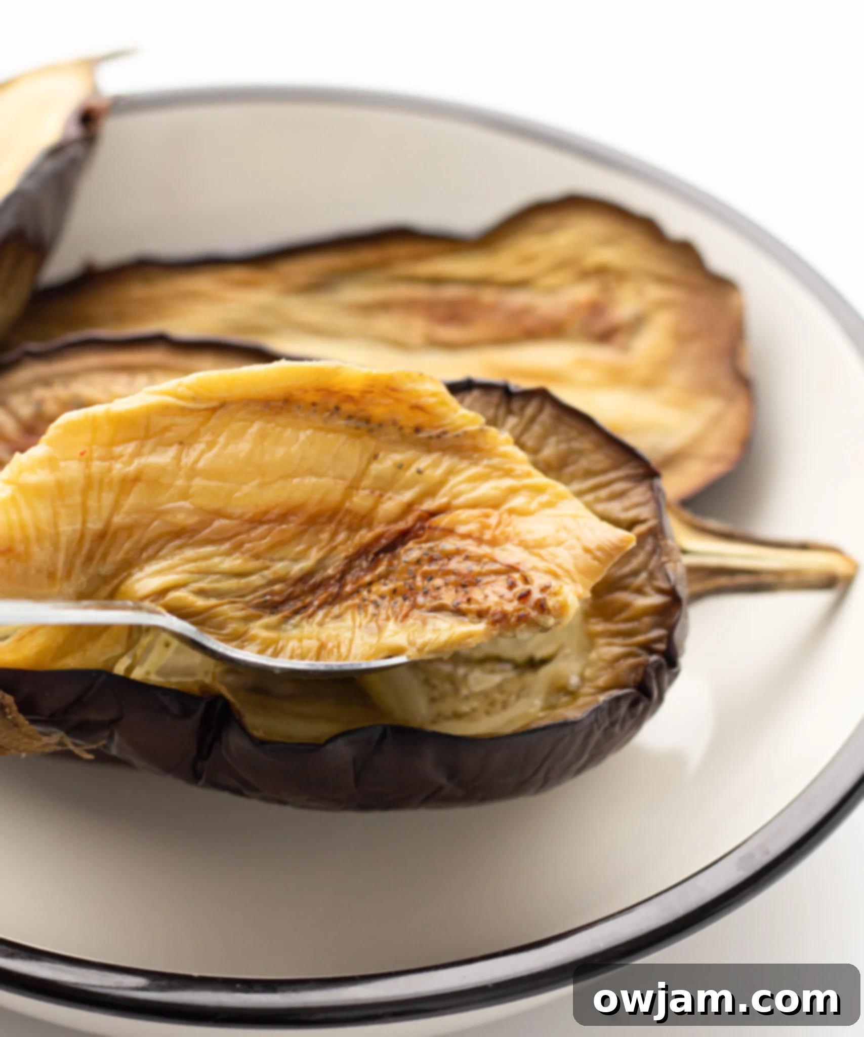 Air Fryer Eggplant scooping out the flesh.
