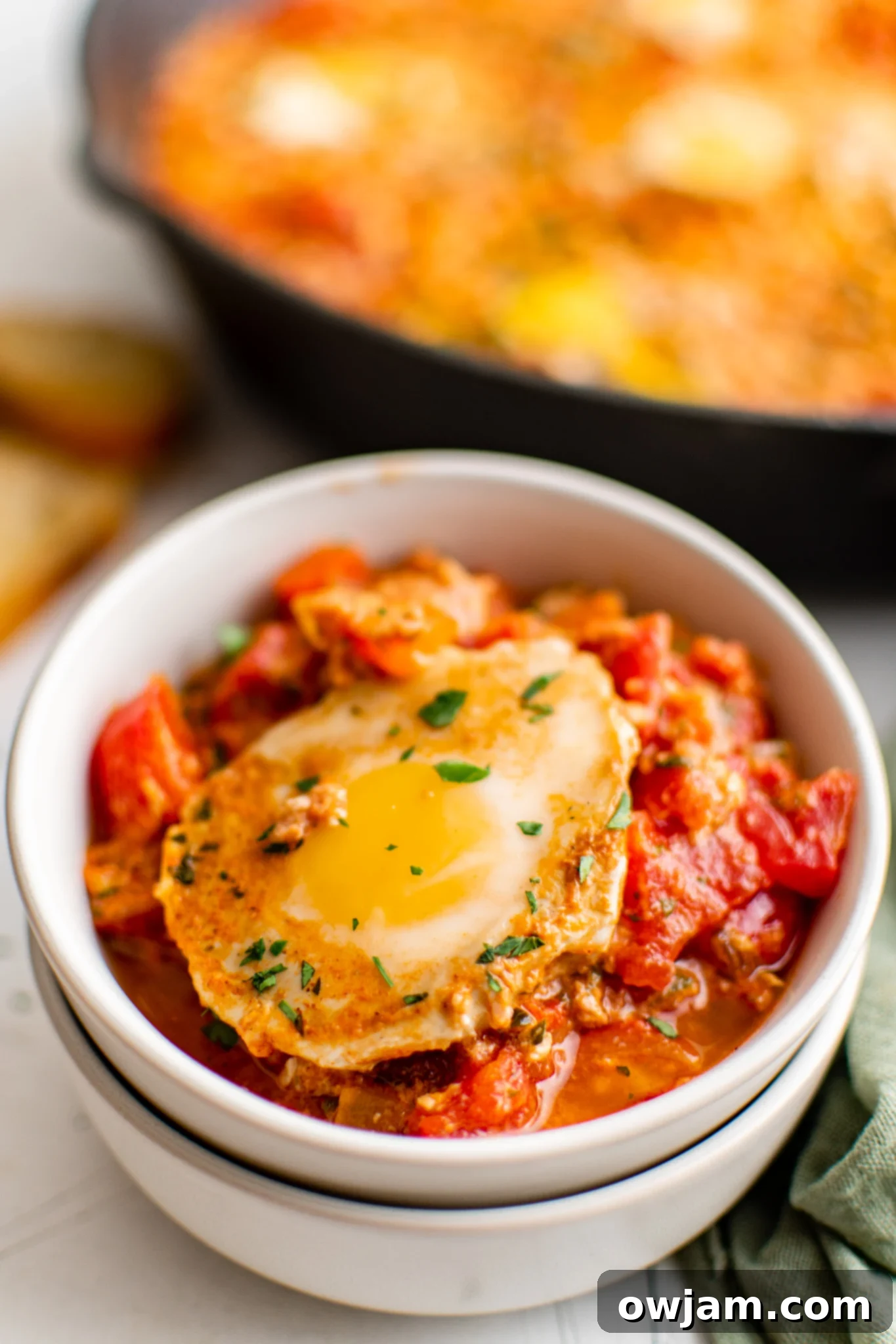 Effortless Shakshuka 3 Easy Shakshuka served in a rustic bowl.