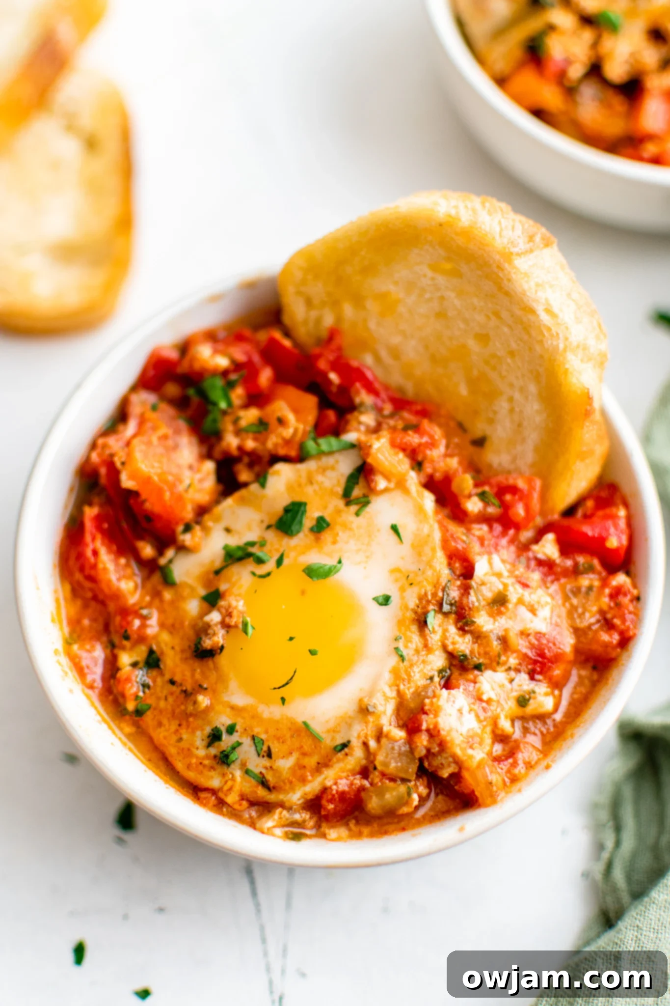 Effortless Shakshuka 4 Serving Easy Shakshuka with crusty bread for dipping.