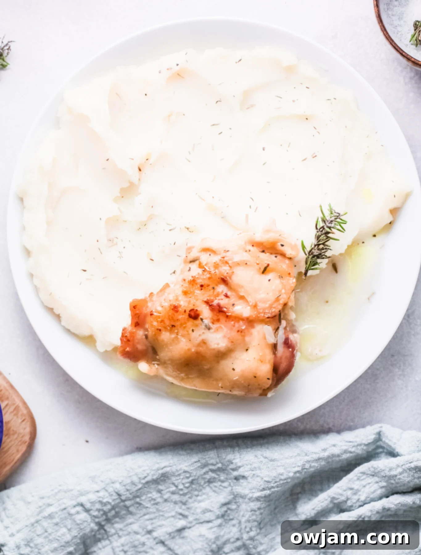 Delicious Instant Pot Creamy Rosemary Chicken 4 Instant Pot Creamy Rosemary Chicken served with mashed potatoes and fresh rosemary.