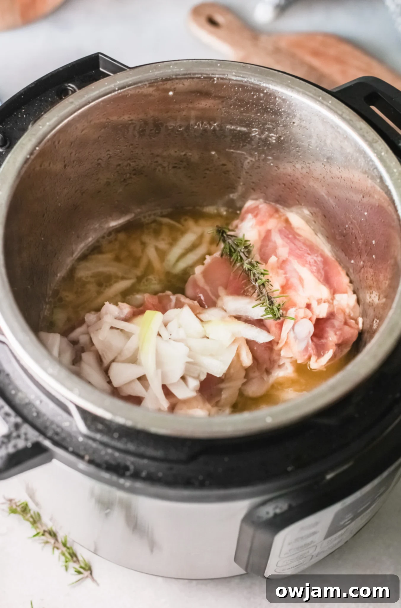 Delicious Instant Pot Creamy Rosemary Chicken 6 Instant Pot Creamy Rosemary Chicken with broth and rosemary added.