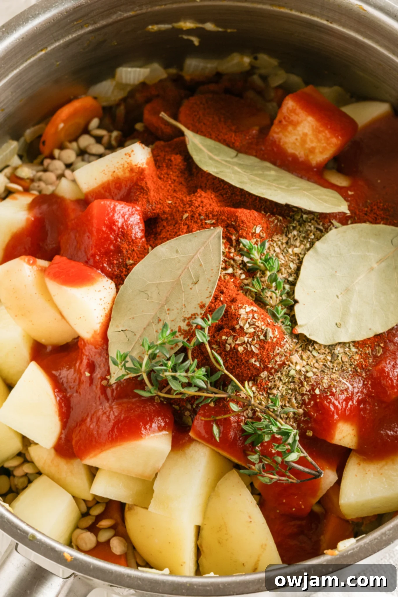 Lentil Mushroom Stew with all ingredients added to the pot, ready to simmer.