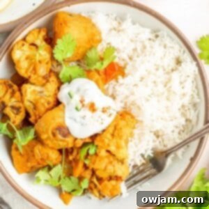 Golden Cauliflower Curry 9 Cauliflower Curry Recipe in a white bowl with a spoon