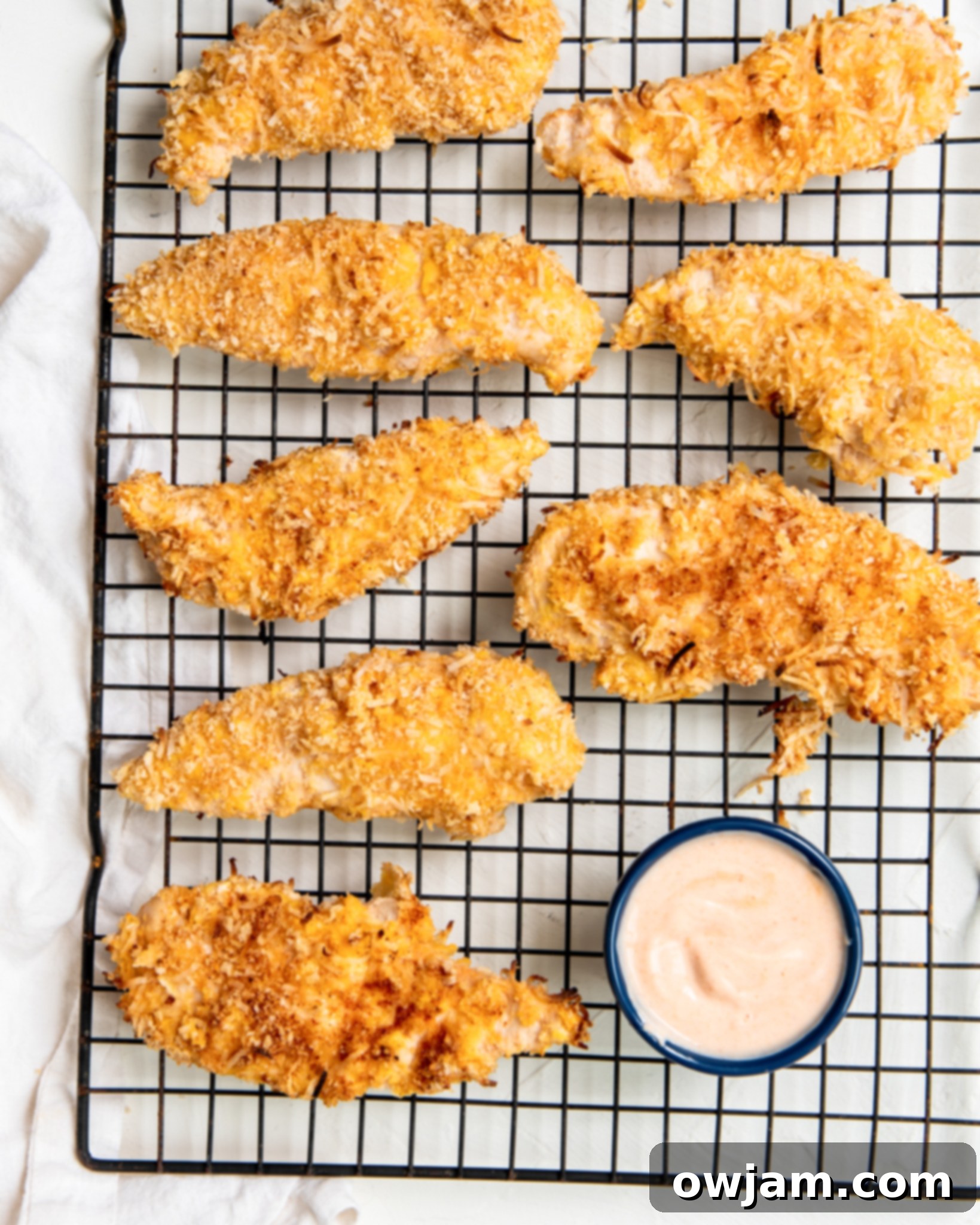 Air Fryer Coconut Chicken Tenders on a baking rack.