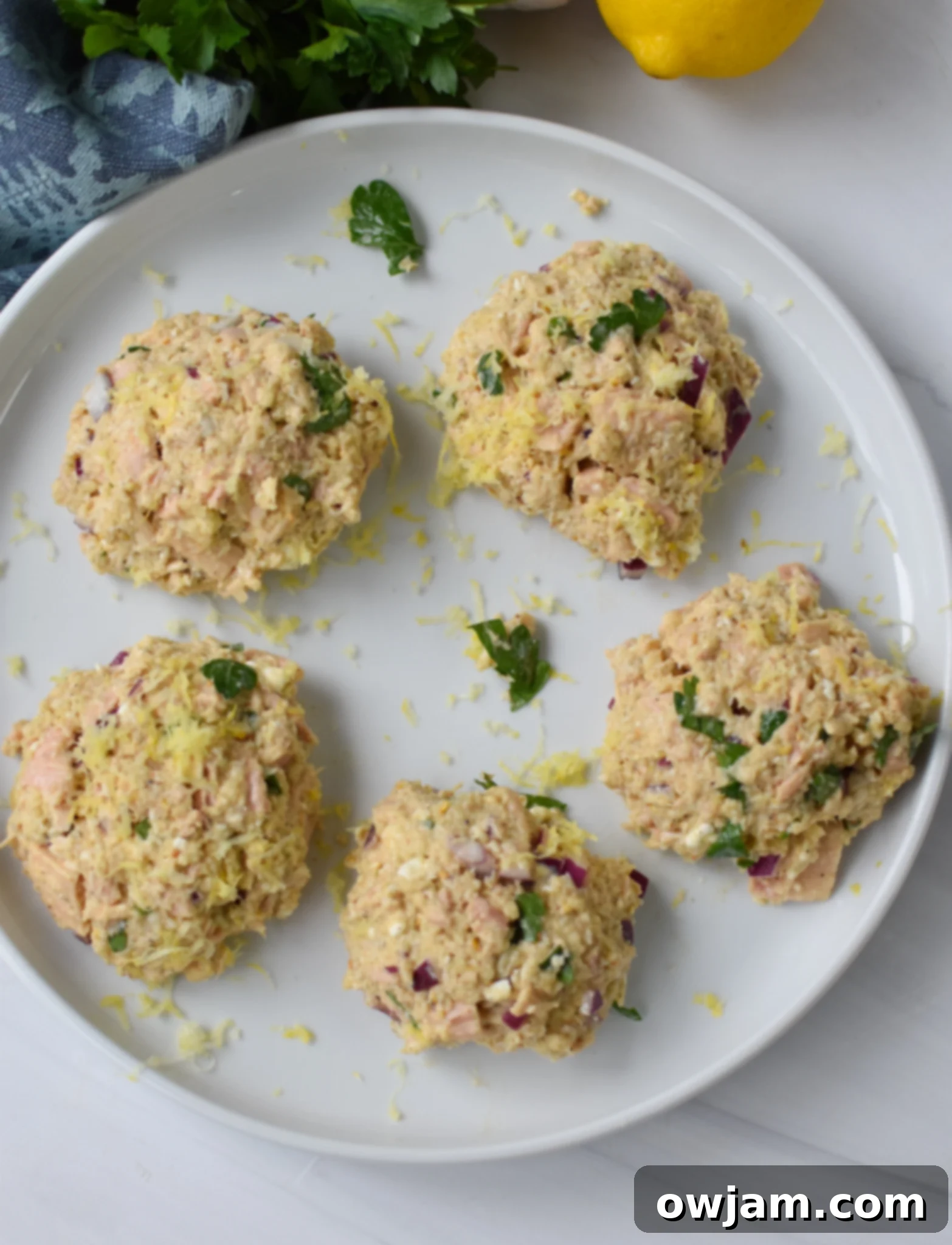 Raw Mediterranean Tuna Patties neatly formed on a platter.