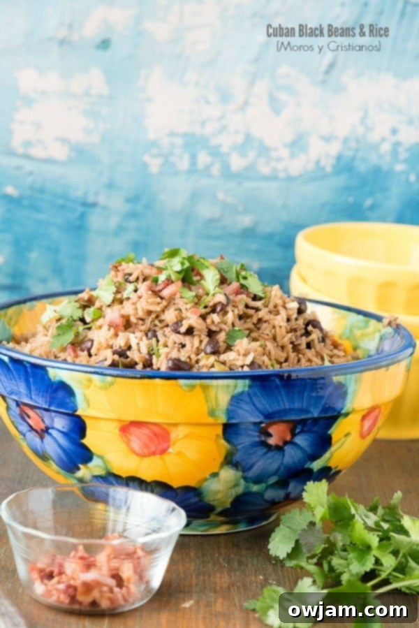 23 Irresistible Sides to Elevate Your Taco Night 10 A bowl of Cuban Black Beans and Rice (Moros y Cristianos), a flavorful and hearty side dish with a rich, dark color.