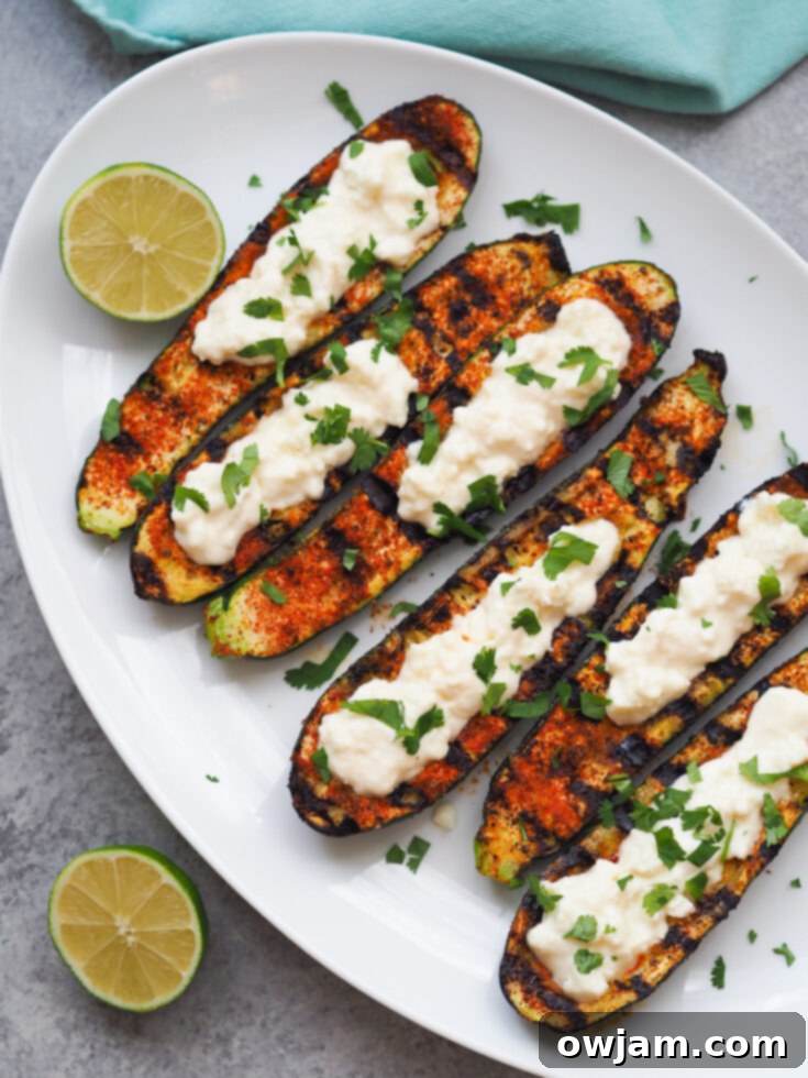 23 Irresistible Sides to Elevate Your Taco Night 21 Grilled Mexican Zucchini Boats, filled with delicious Mexican-inspired ingredients like corn, beans, and cheese, baked to perfection.