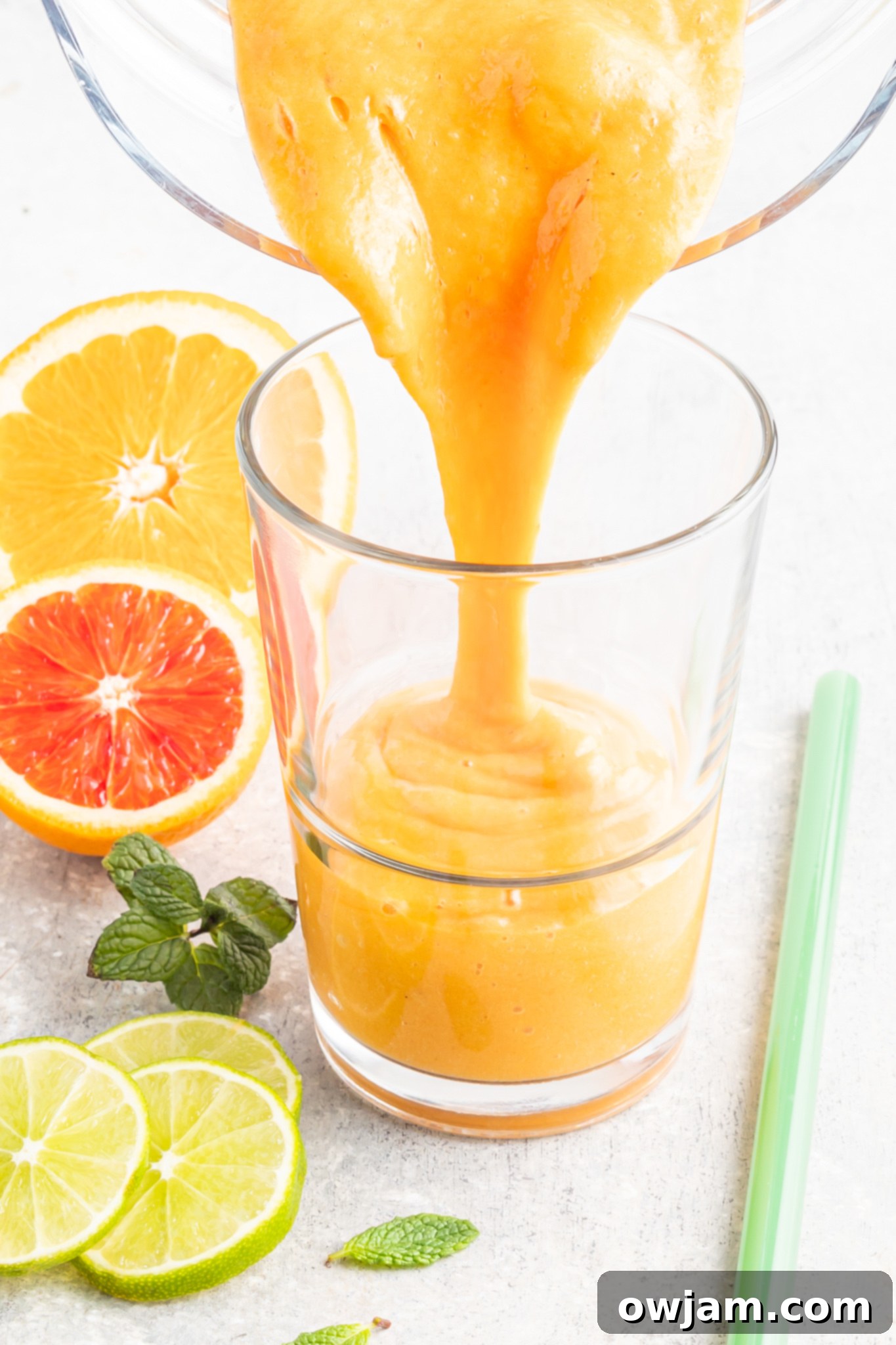 Refreshing Orange Smoothie served in a glass cup, ready to drink.