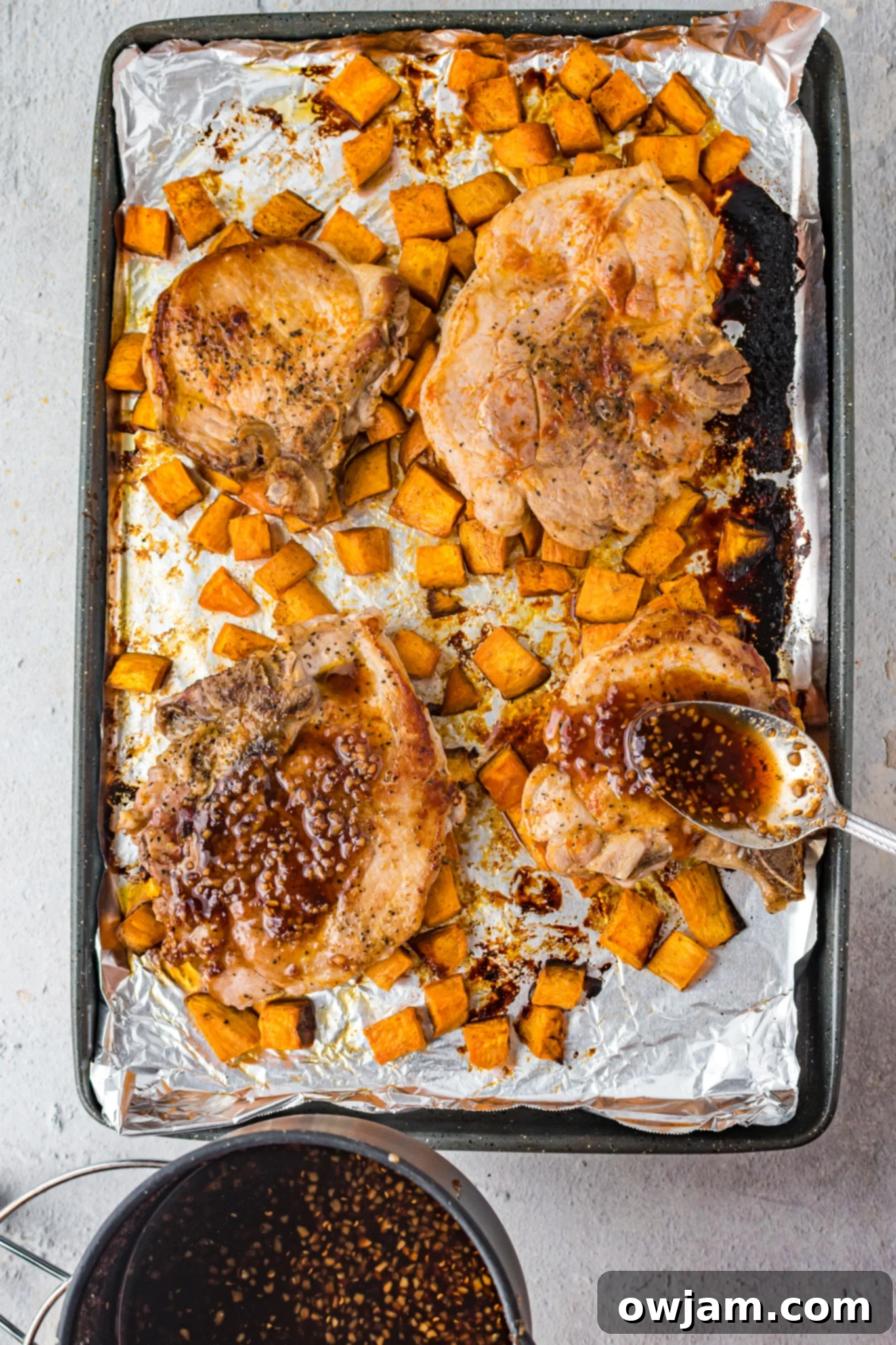Maple Bourbon Glazed Pork Chops Recipe 11 Maple Bourbon Pork Chops Recipe with glaze generously applied on pork chops.