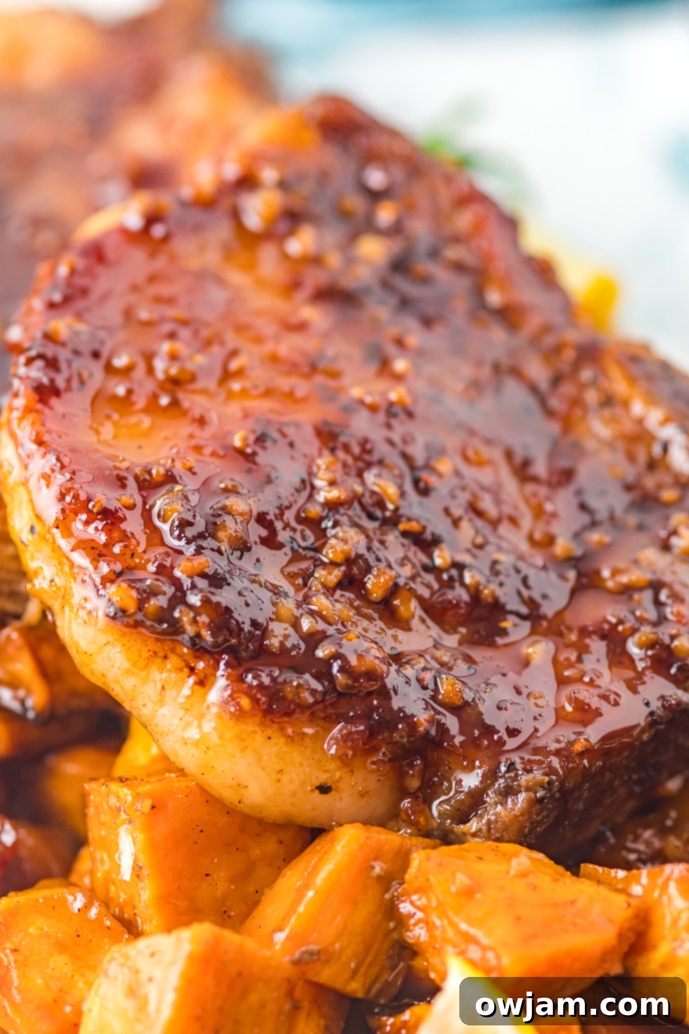 Maple Bourbon Glazed Pork Chops Recipe 3 Maple Bourbon Pork Chops Recipe with glossy glaze glistening.