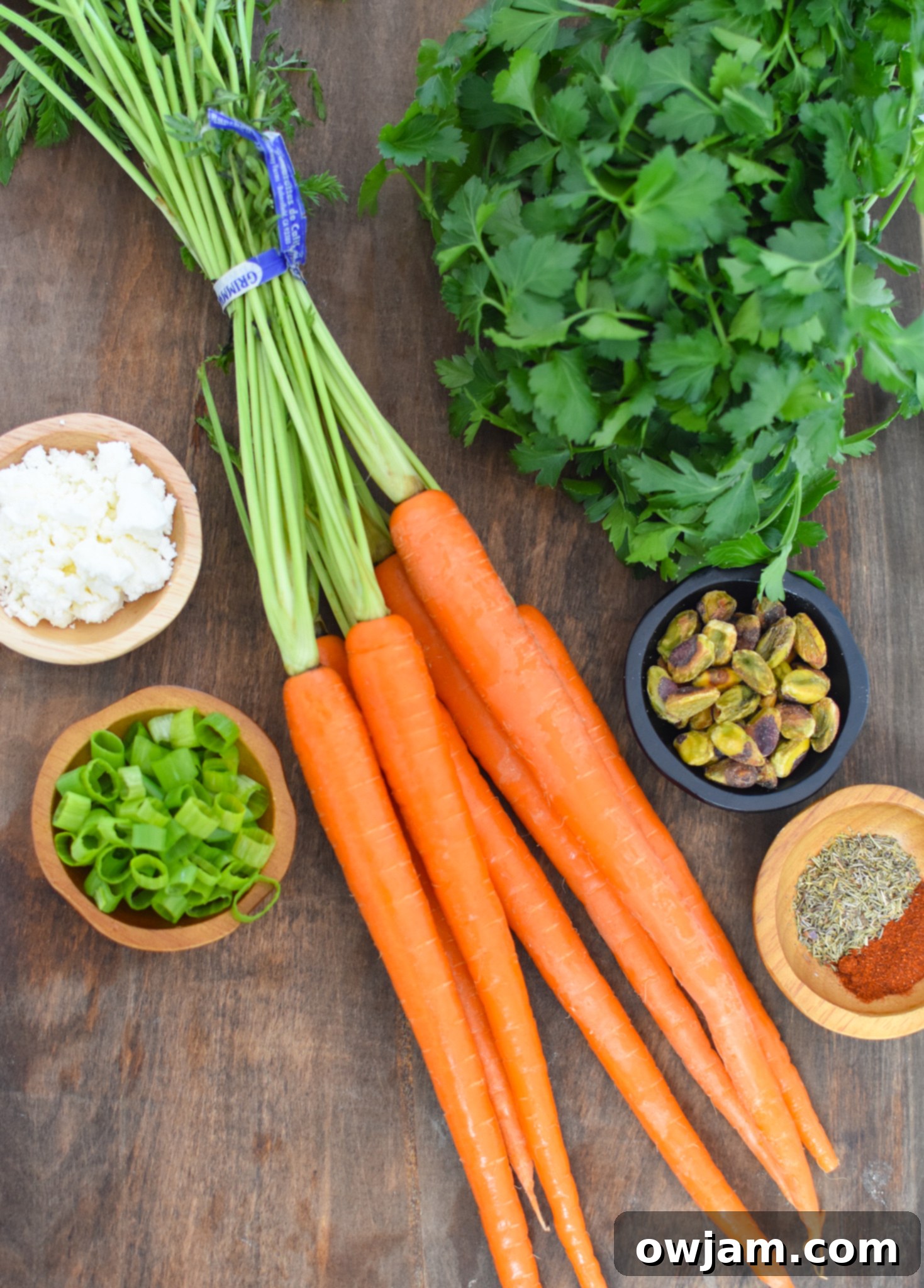 Roasted Carrots with Pistachios ingredients laid out on a table.