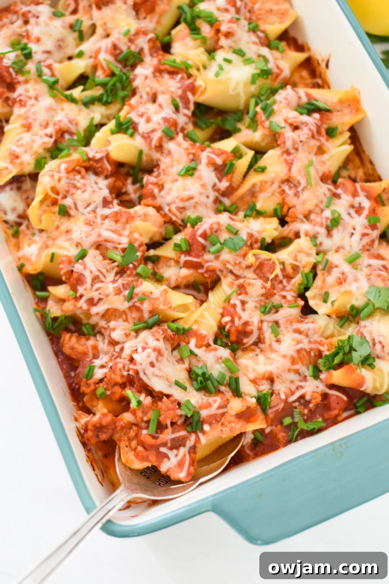 Veal Stuffed Shells with spoon.