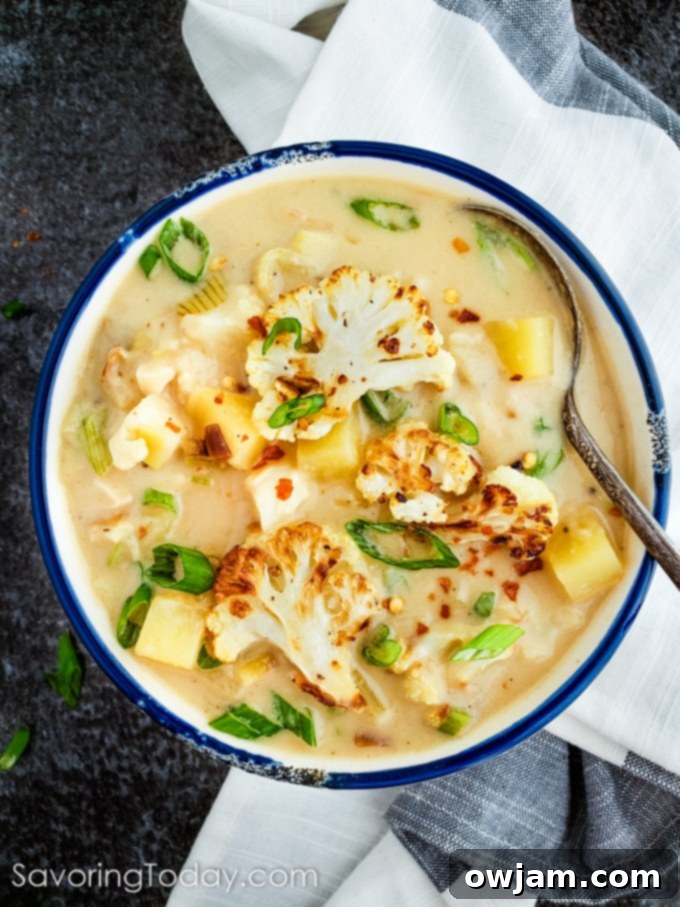 Creamy Roasted Cauliflower & Potato Leek Soup in a bowl with fresh chives