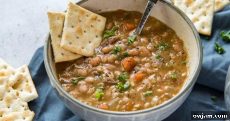 Hearty Instant Pot Navy Bean Soup in a white bowl