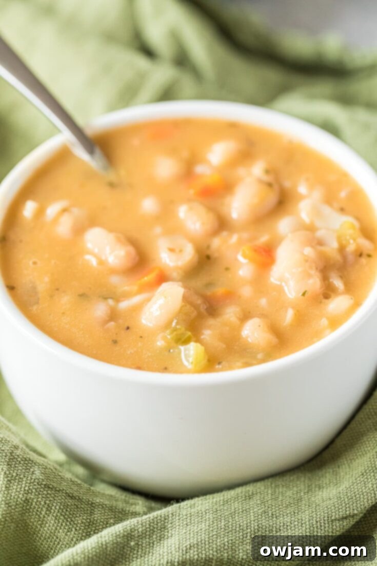 Flavorful Vegan White Bean Soup garnished with fresh parsley