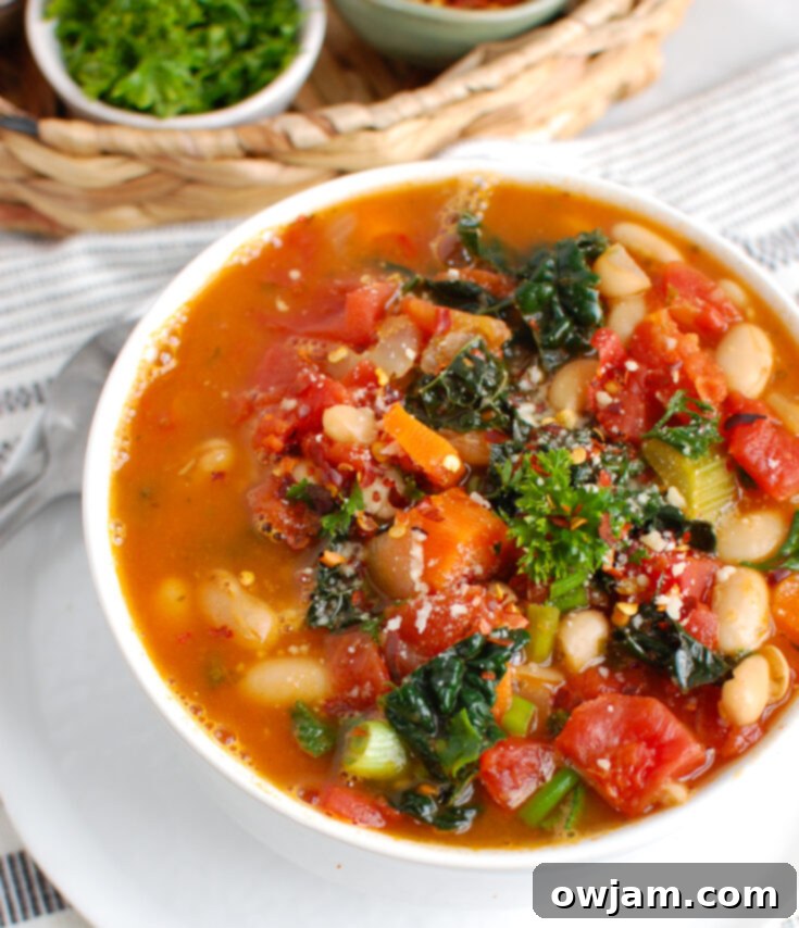 Comforting White Bean Soup in a bowl garnished with fresh herbs