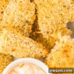 Crispy Baked Parmesan Fish Sticks with homemade dip.