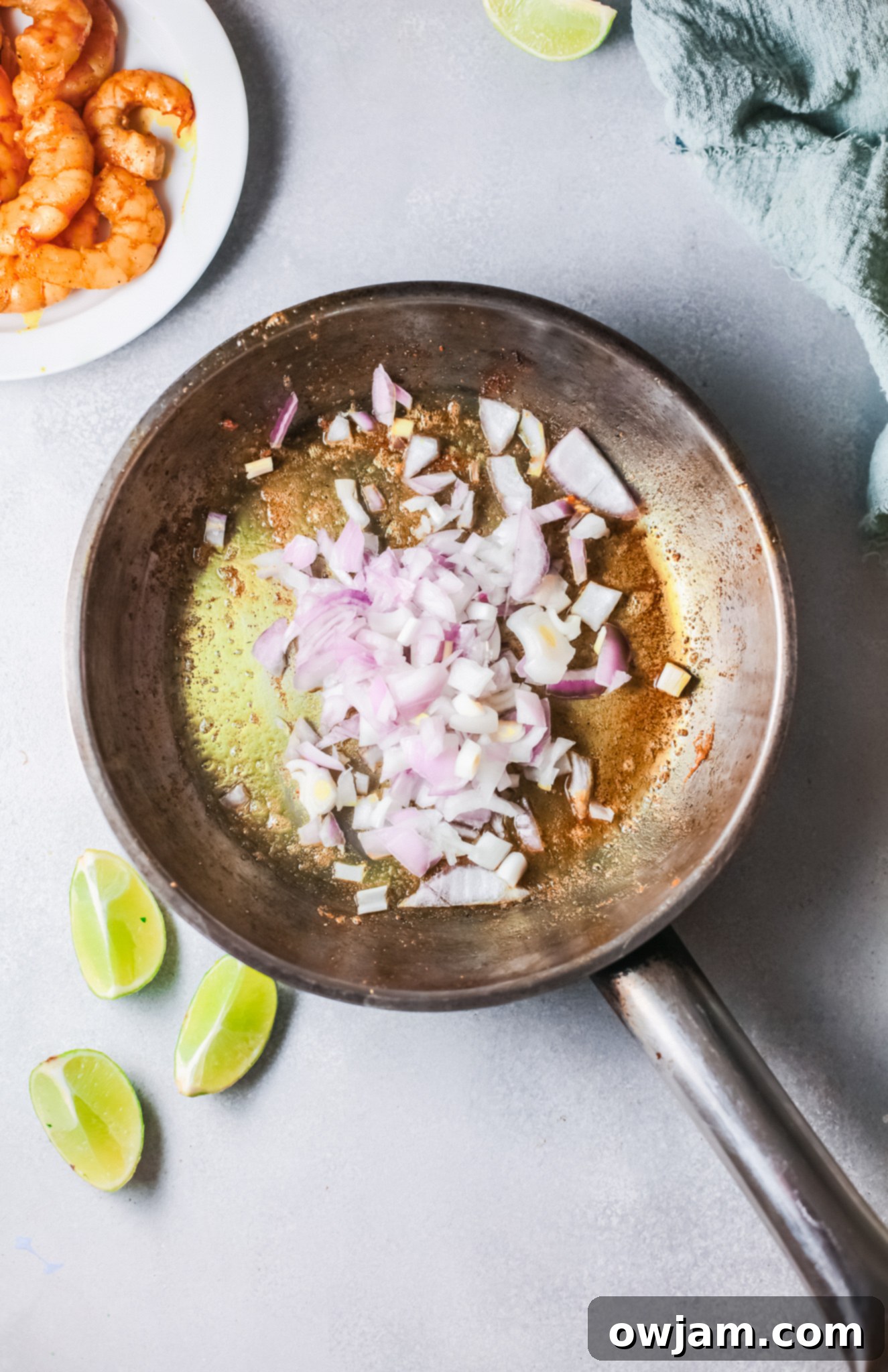 Go-To Shrimp Curry 7 Easy Shrimp Curry Recipe showing the curry sauce simmering in a skillet.