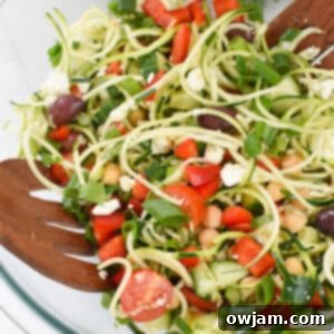 Sun-Kissed Zucchini Pasta Medley 10 Mediterranean Zucchini Pasta Salad in a glass bowl.