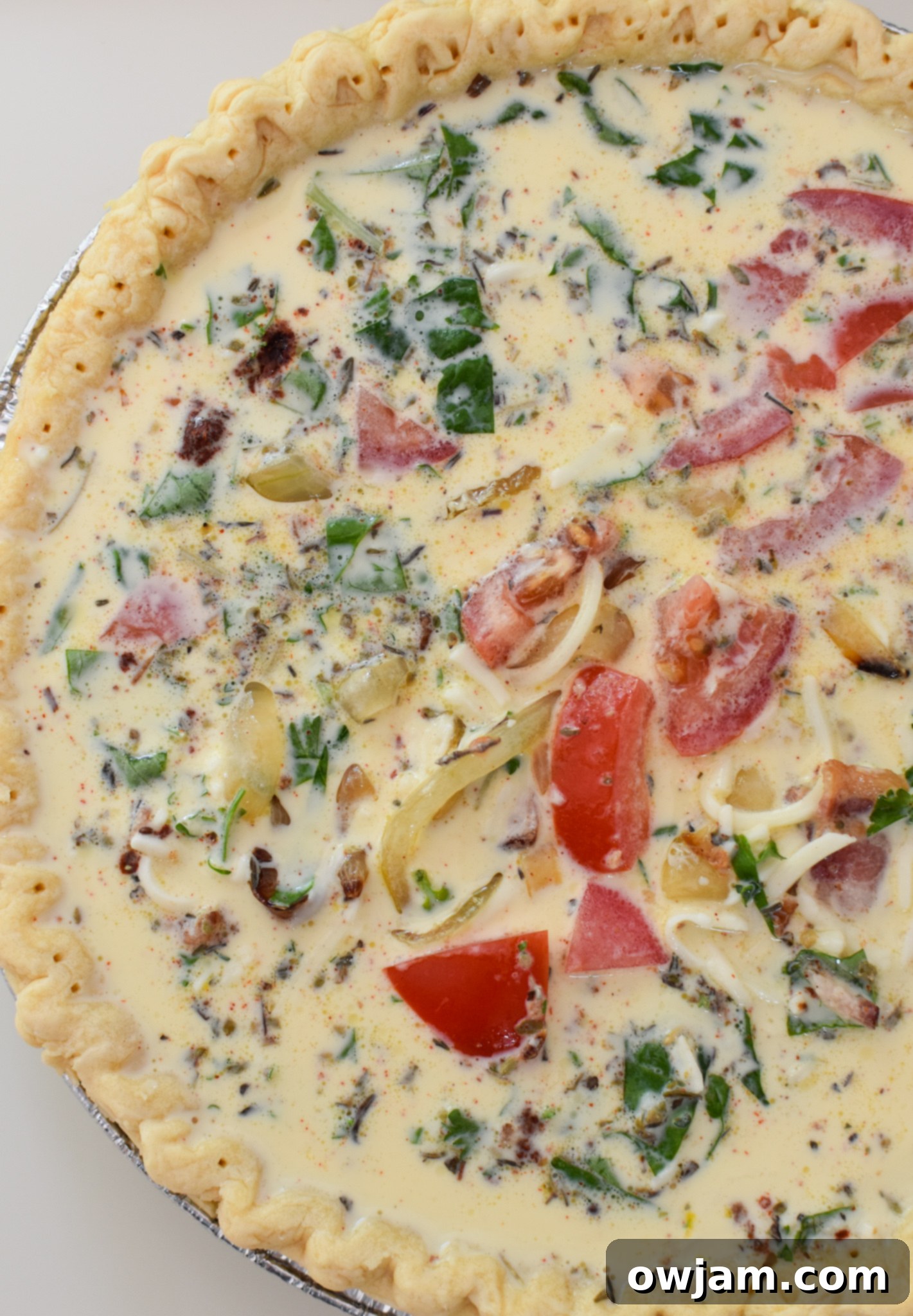 Caprese Quiche Lorraine Delight 8 Caprese Quiche Lorraine Recipe egg mixture in pie crust.