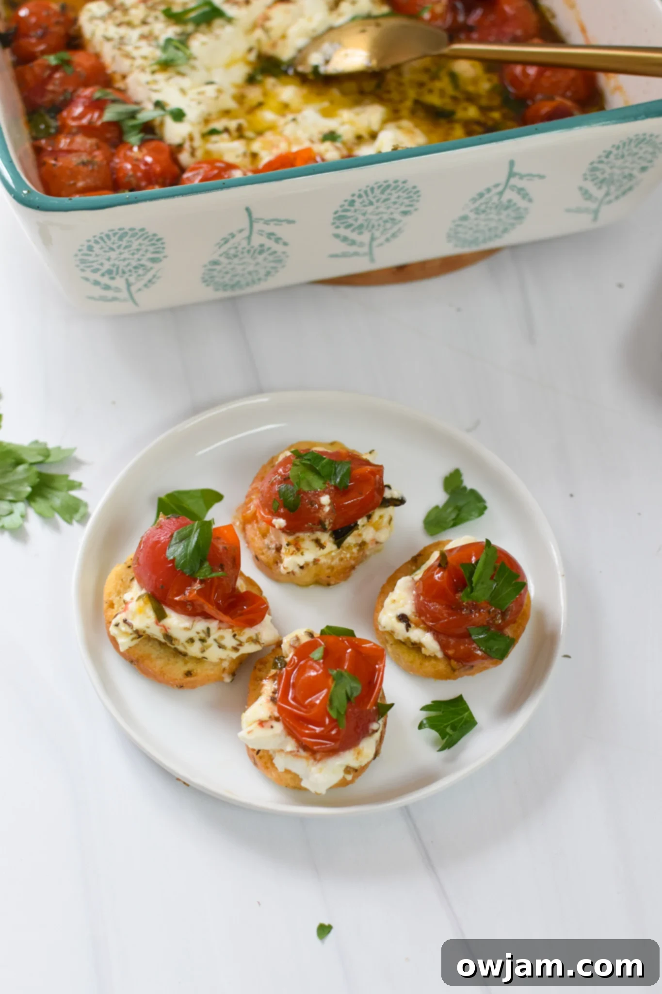 Simple Baked Feta Perfection 8 Easy Baked Feta Recipe served on a platter with crispy crostini, inviting guests to enjoy this delicious dip.