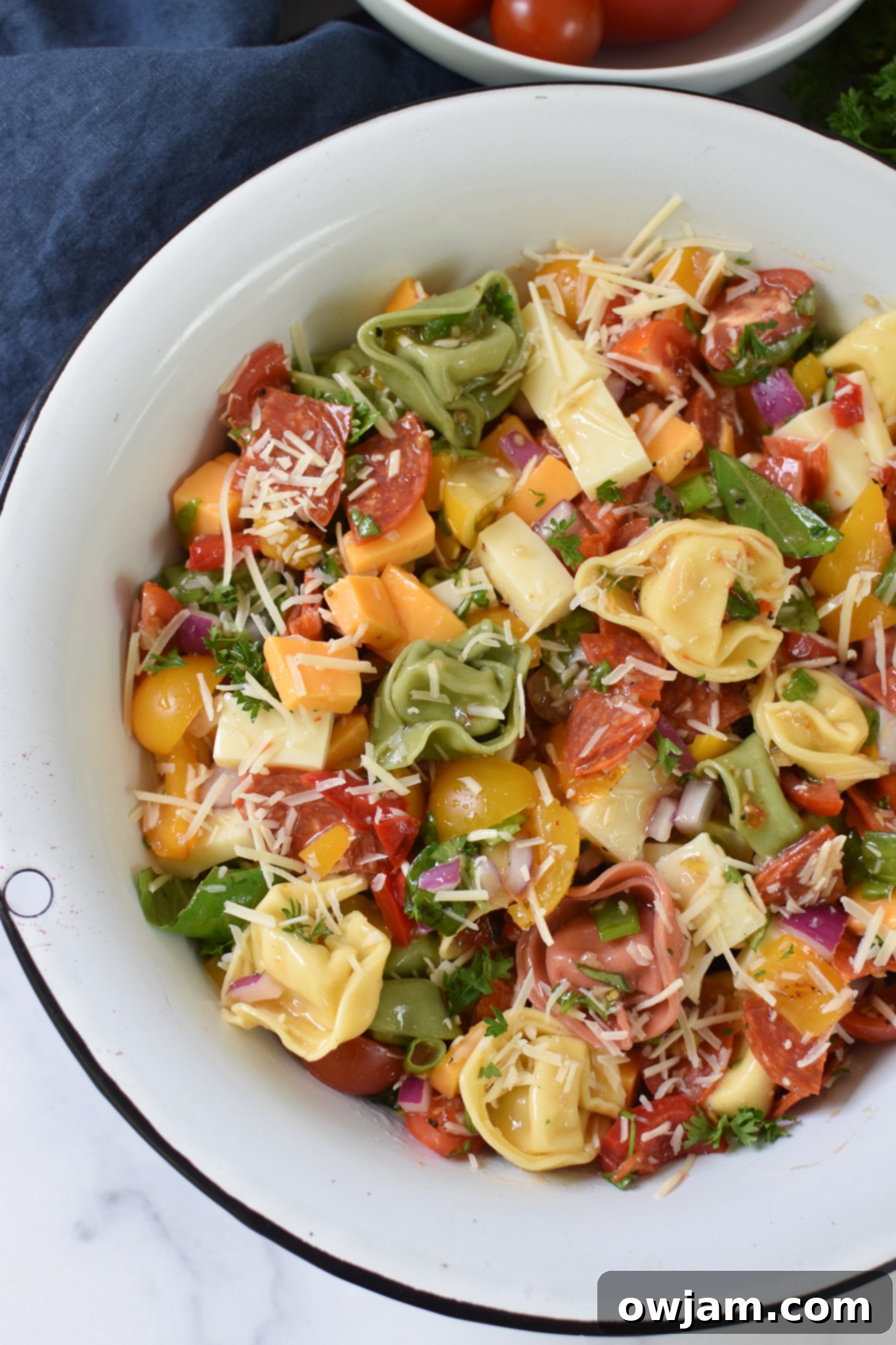 Italian Tortellini Salad in a white bowl. 