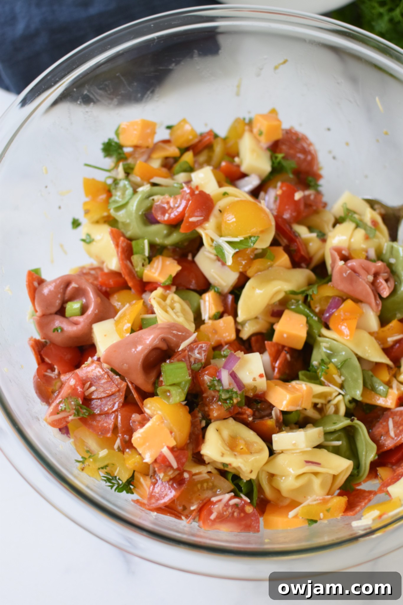 Italian Tortellini Salad in a clear bowl.