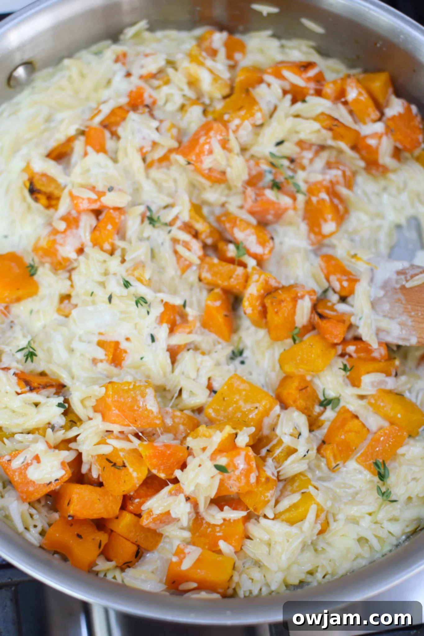 Golden Cheesy Butternut Squash Orzo 6 Cheesy Butternut Squash Orzo making the orzo in a pan.