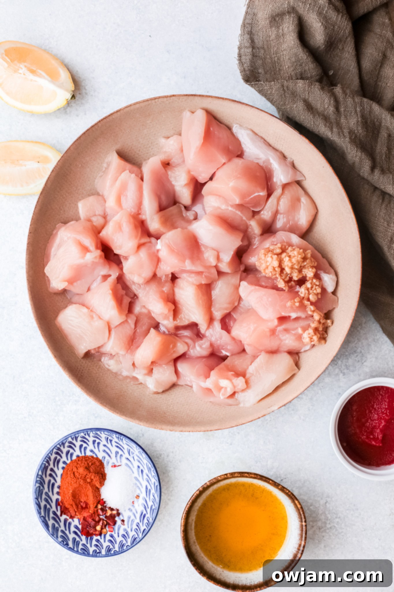 Authentic Lebanese Chicken Skewers 4 A bowl filled with the fresh ingredients for Lebanese Chicken Kebabs marinade.