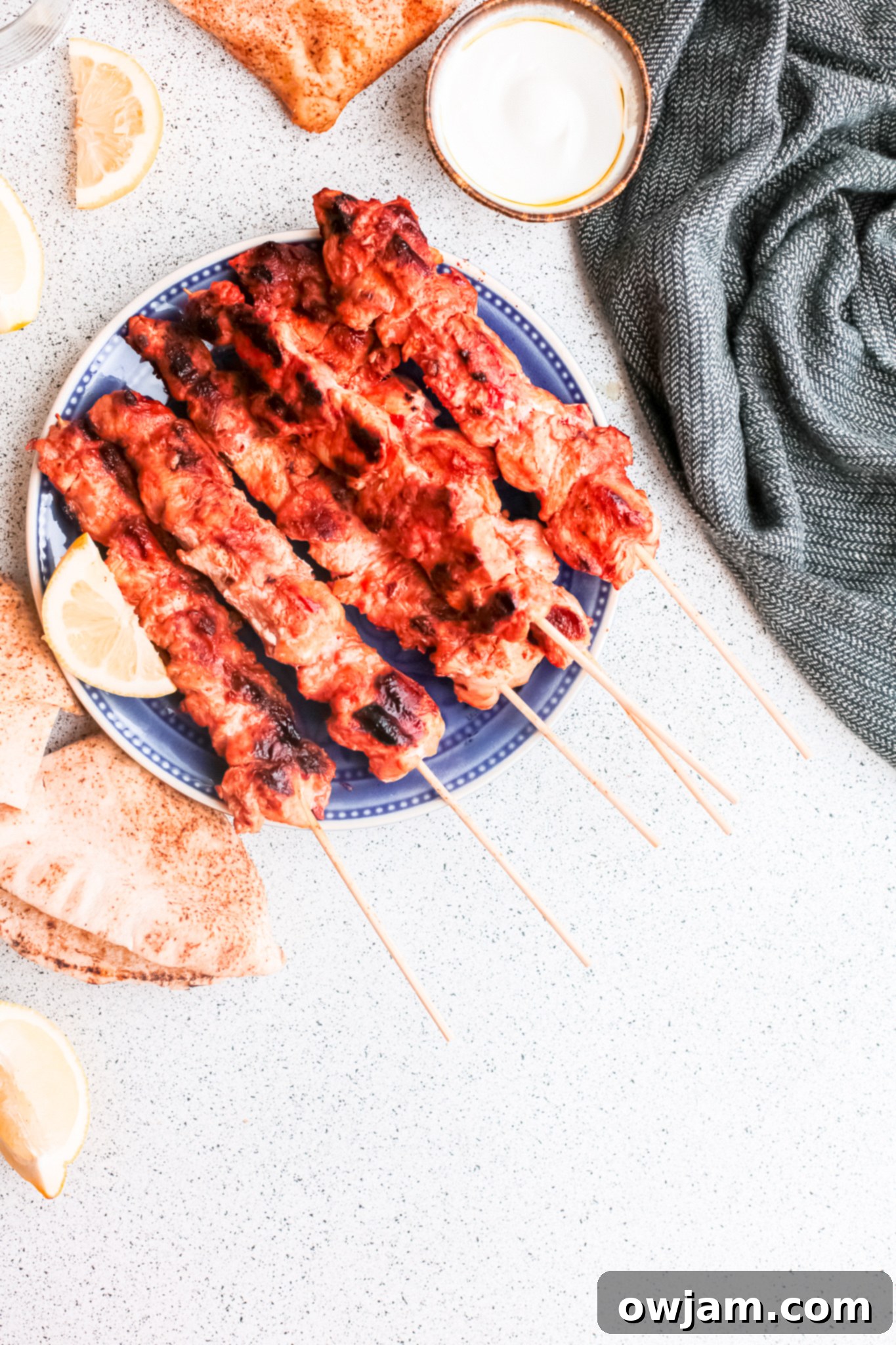 Authentic Lebanese Chicken Skewers 8 Lebanese Chicken Kebabs served with warm pita bread and fresh herbs.
