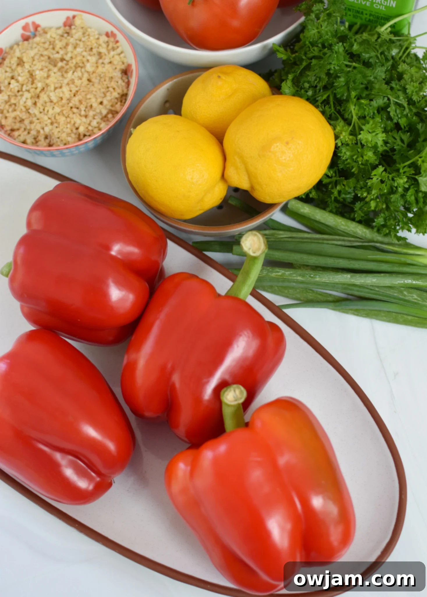 Zesty Tabbouleh Stuffed Peppers 3 Vegan Stuffed Peppers Recipe ingredients laid out on a table.