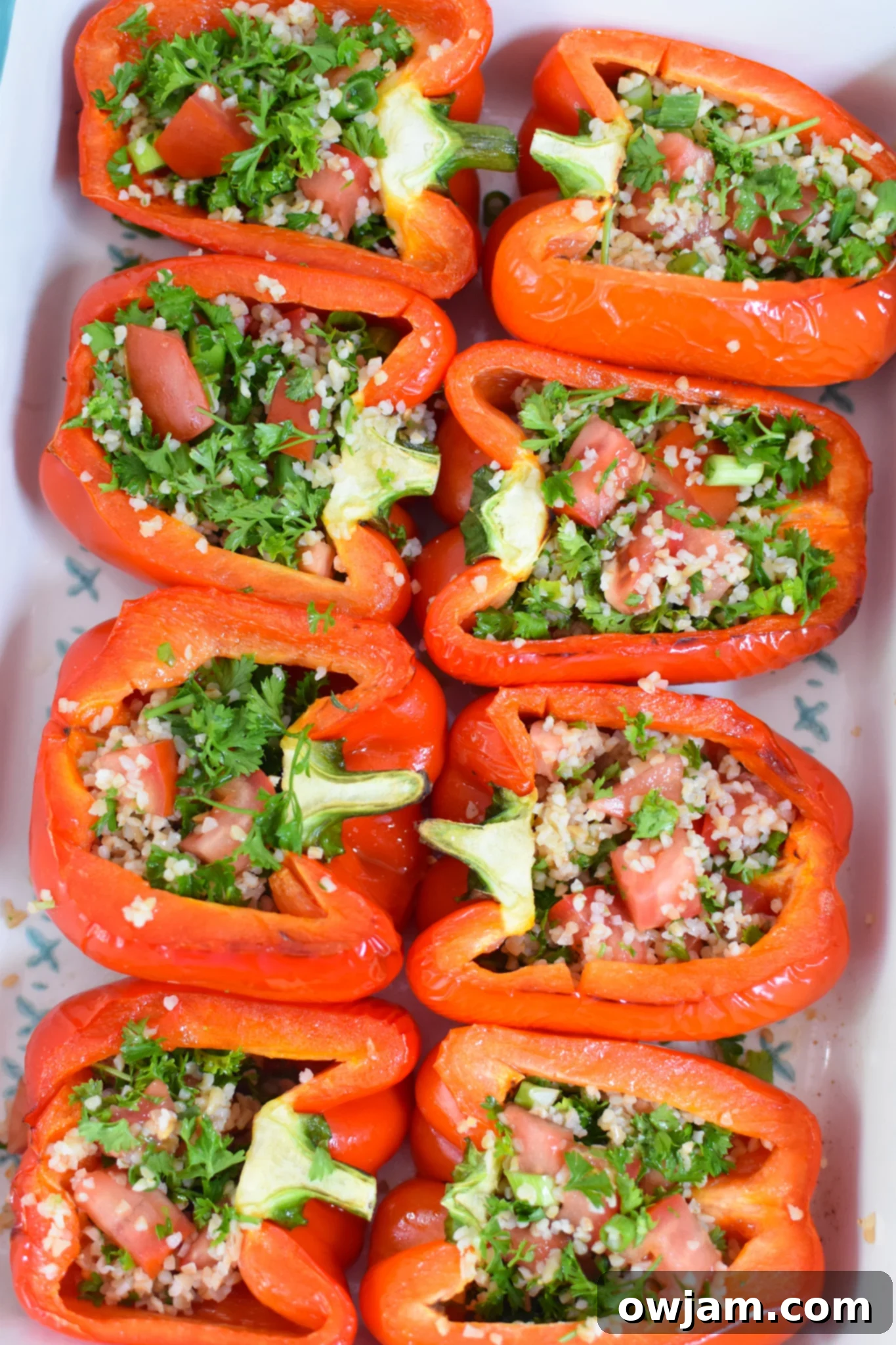 Zesty Tabbouleh Stuffed Peppers 8 Vegan Stuffed Peppers Recipe with tabbouleh filling in bell peppers, ready for final baking.