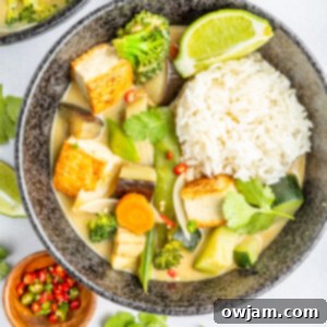 Thai Vegetable Green Curry with lime wedges.