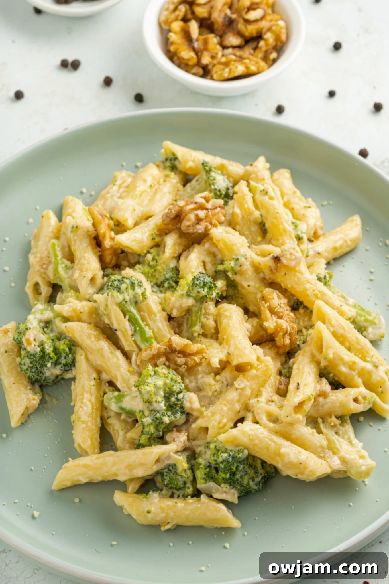 Creamy Broccoli Pasta Recipe with a light green plate. 
