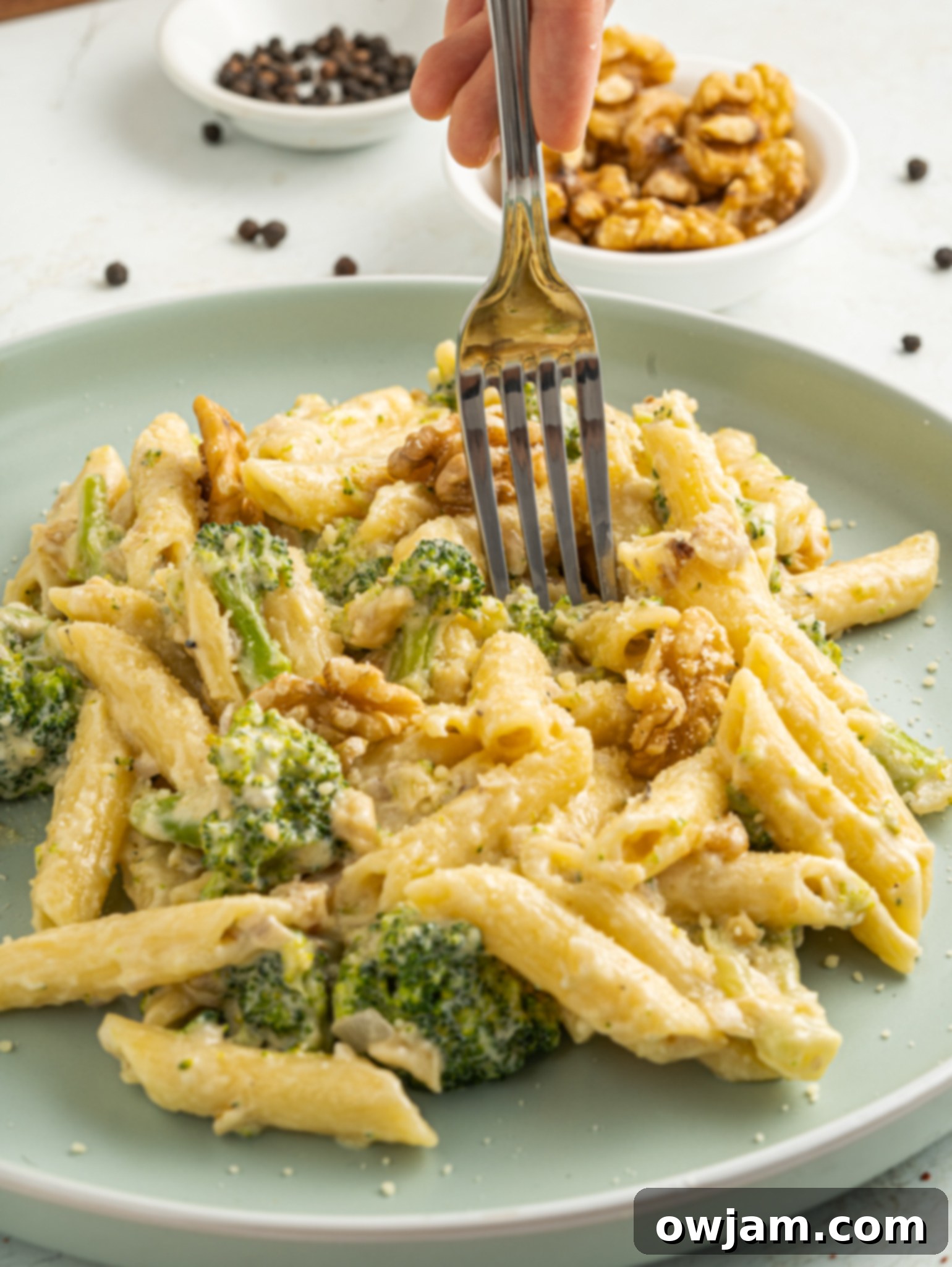 Creamy Broccoli Pasta Recipe with a fork.