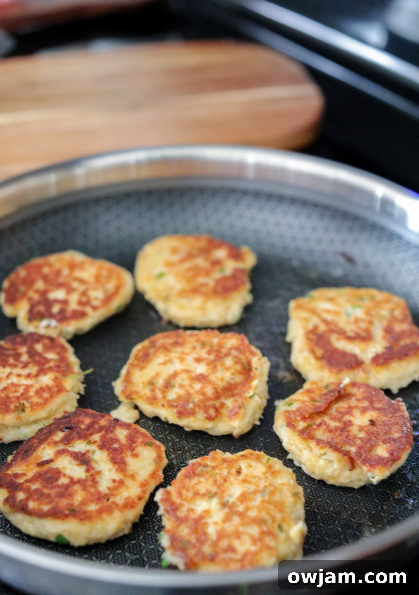 Effortless Crab Cake Perfection 8 Easy Crab Cake Recipe crab cakes in skillet.