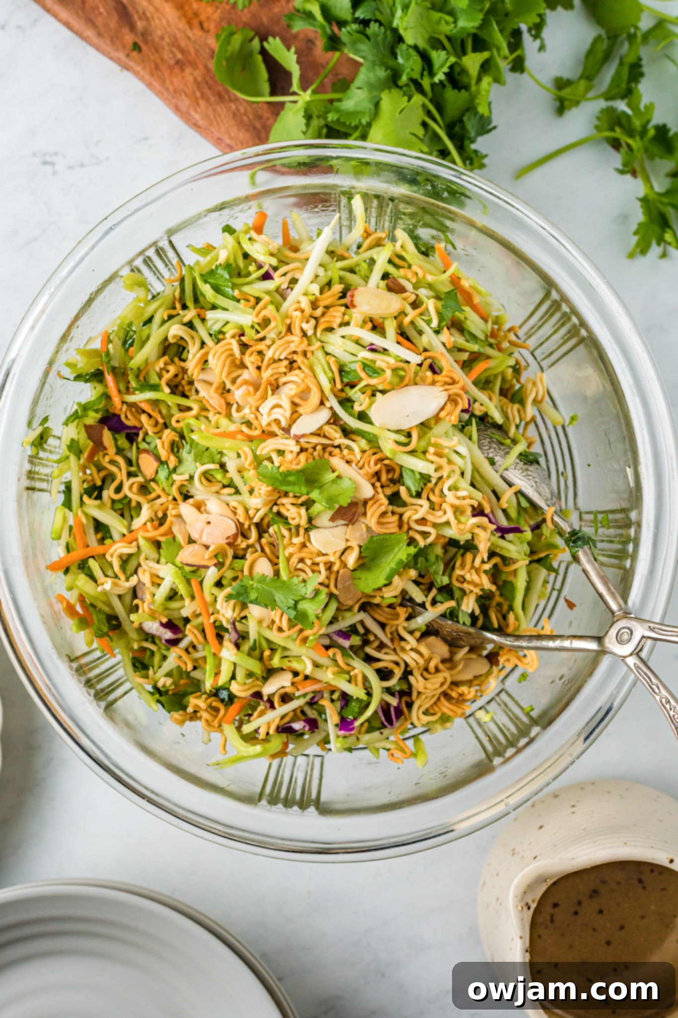 Zesty Broccoli Slaw 5 Broccoli Slaw Recipe in a clear glass bowl.