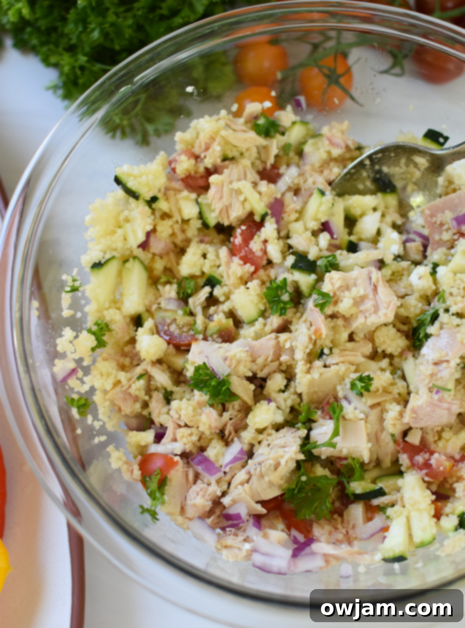 Flavorful Mediterranean Tuna Couscous Stuffed Bell Peppers 6 A large mixing bowl filled with the vibrant Mediterranean tuna, couscous, and vegetable stuffing, ready to be put into peppers.